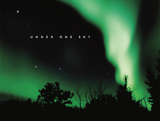Northern Lights over trees, with the words Under One Sky